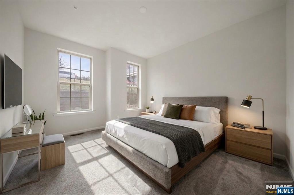 69 Arnold Drive, Unit 5810 Wood-Ridge, NJ 07075 - Photo 19 of 45 a bedroom with a bed and a window