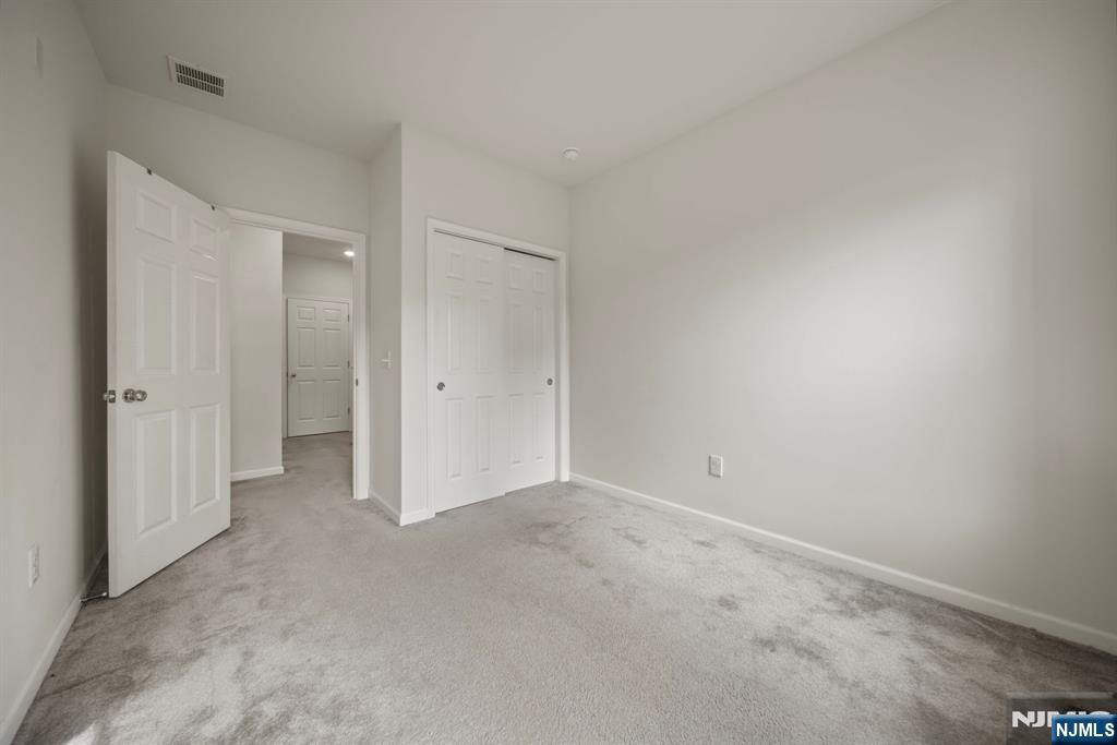 69 Arnold Drive, Unit 5810 Wood-Ridge, NJ 07075 - Photo 26 of 45 an empty room with an entryway