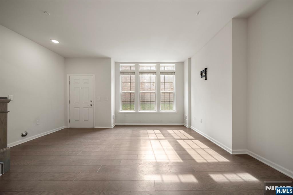 69 Arnold Drive, Unit 5810 Wood-Ridge, NJ 07075 - Photo 10 of 45 an empty room with windows