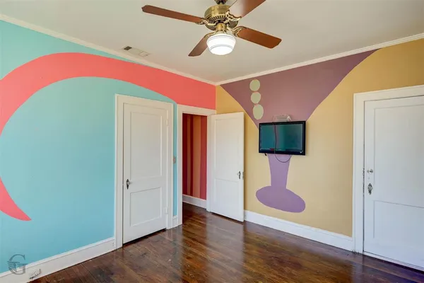 a view of an entryway with wooden floor