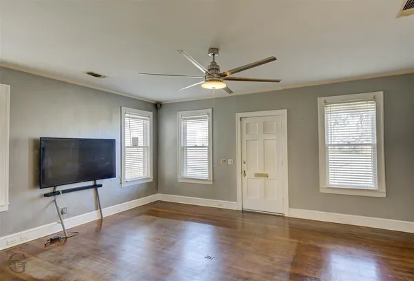 a living room with fireplace furniture and a flat screen tv