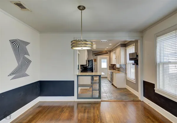 a view of a living room and dining room