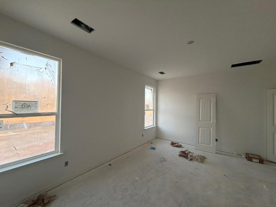 1253 Sabine River Lane Springtown, TX 76082 - Photo 5 of 8 a view of an empty room and a window