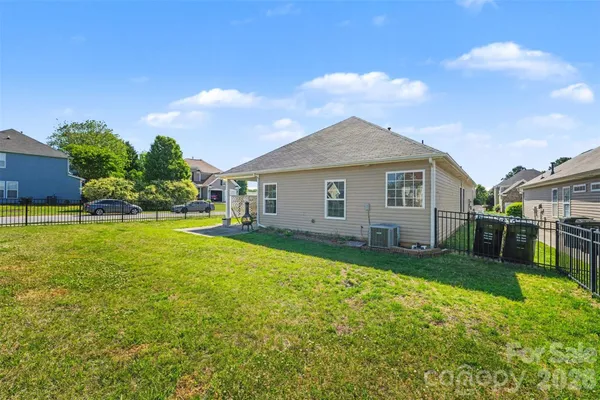 a front view of a house with yard and green space