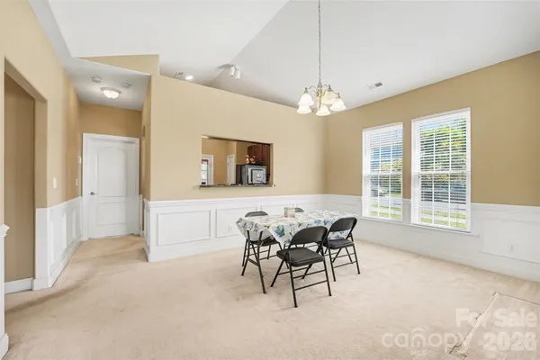 a view of a livingroom with furniture window and wooden floor