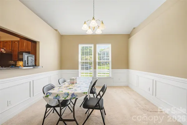 a view of a dining room with furniture window and outside view