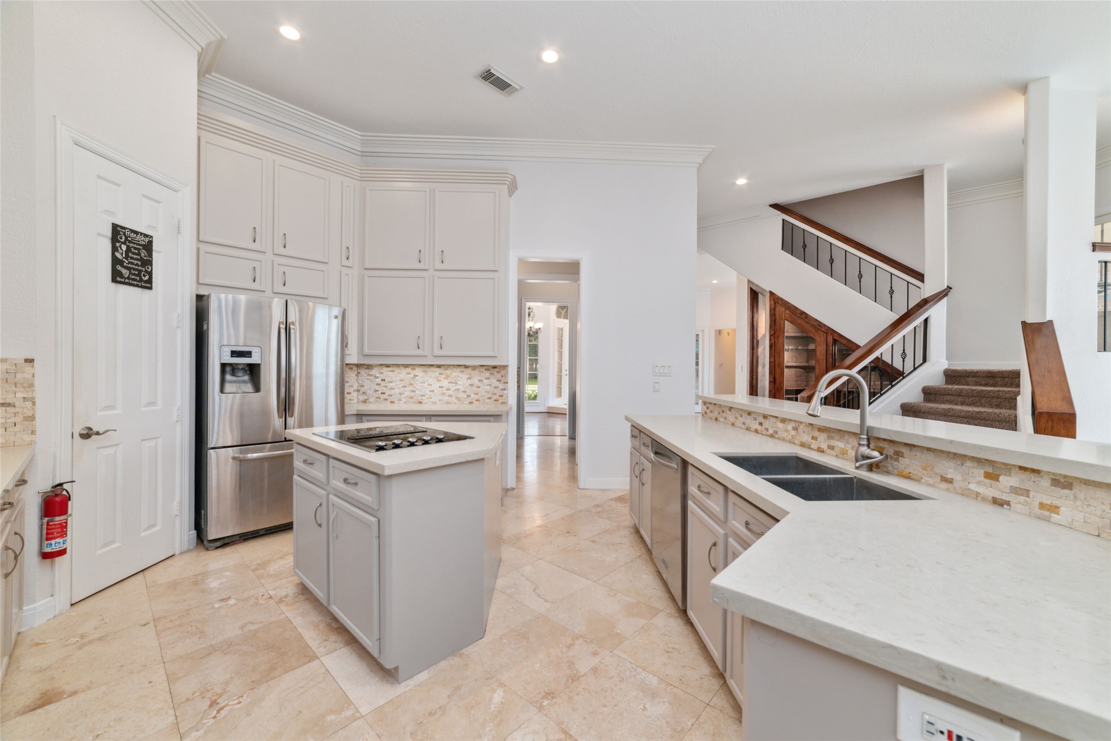 32610 Whitburn Trail Fulshear, TX 77441 - Photo 17 of 49 a kitchen with a stove and a refrigerator