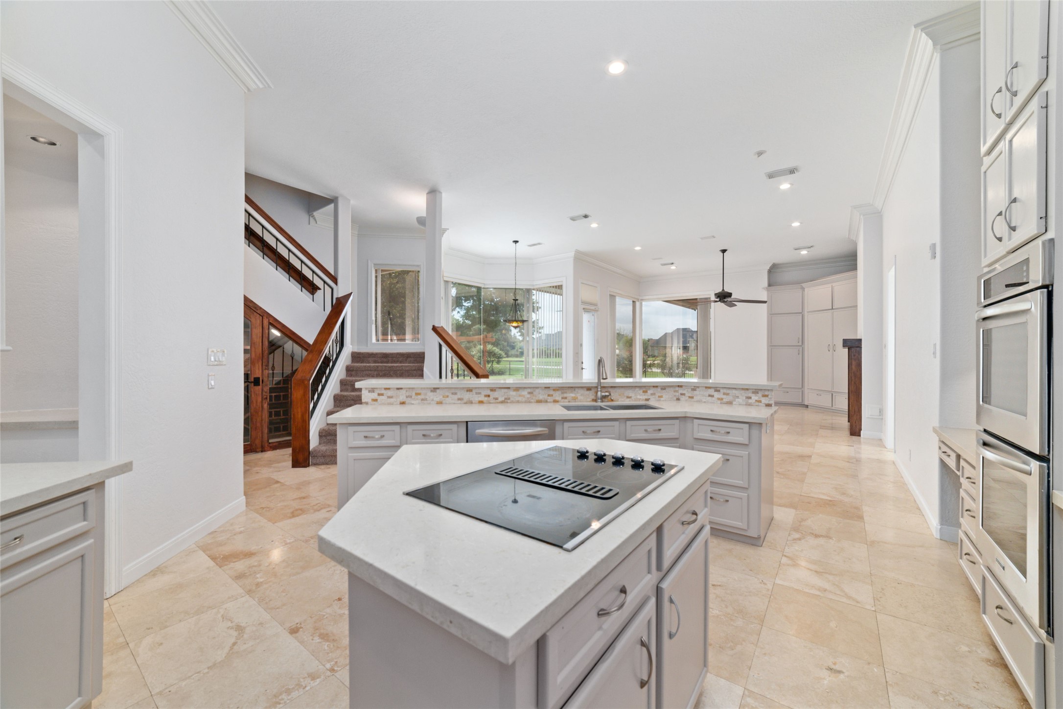 32610 Whitburn Trail Fulshear, TX 77441 - Photo 18 of 49 a kitchen that has a sink a stove and a refrigerator