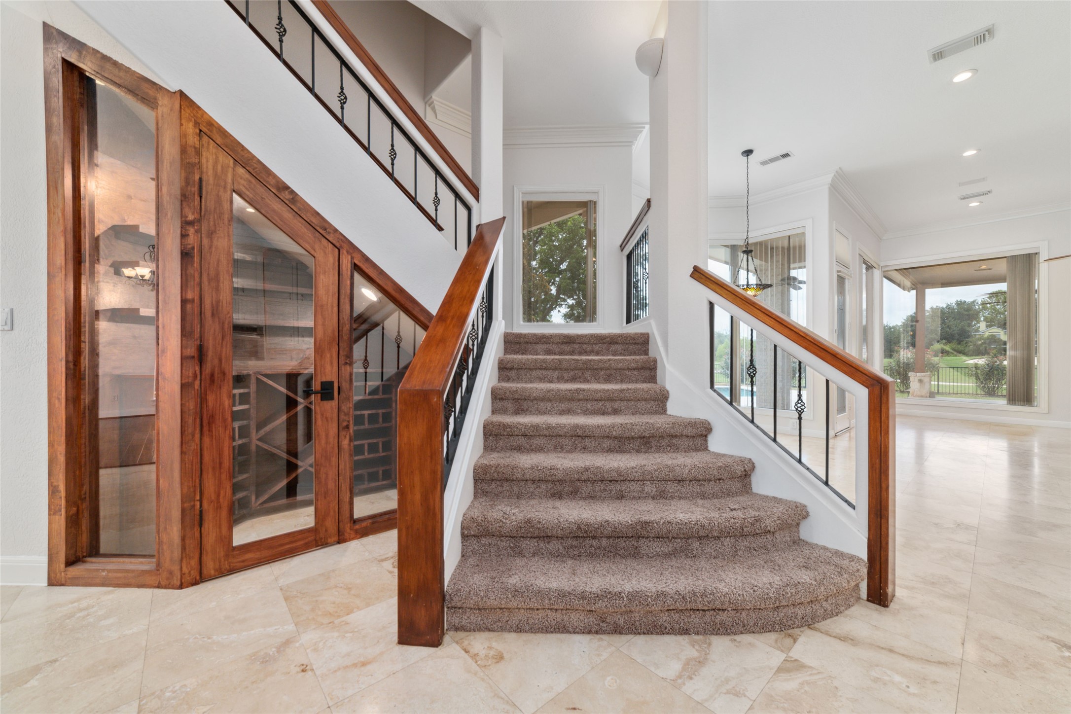 32610 Whitburn Trail Fulshear, TX 77441 - Photo 23 of 49 a view of staircase with lots of frames and a entertaining space