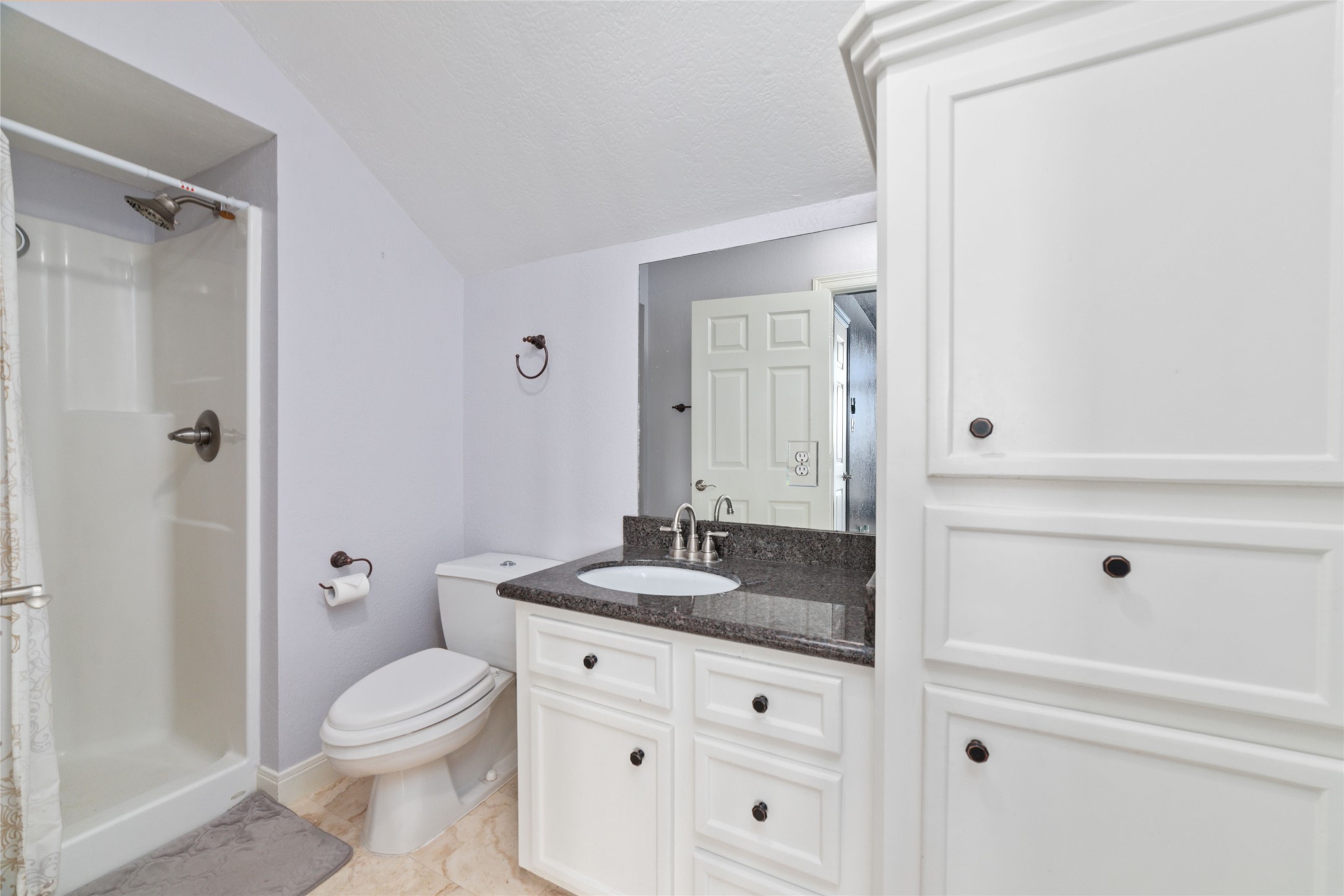 32610 Whitburn Trail Fulshear, TX 77441 - Photo 25 of 49 a bathroom with a granite countertop sink toilet and shower