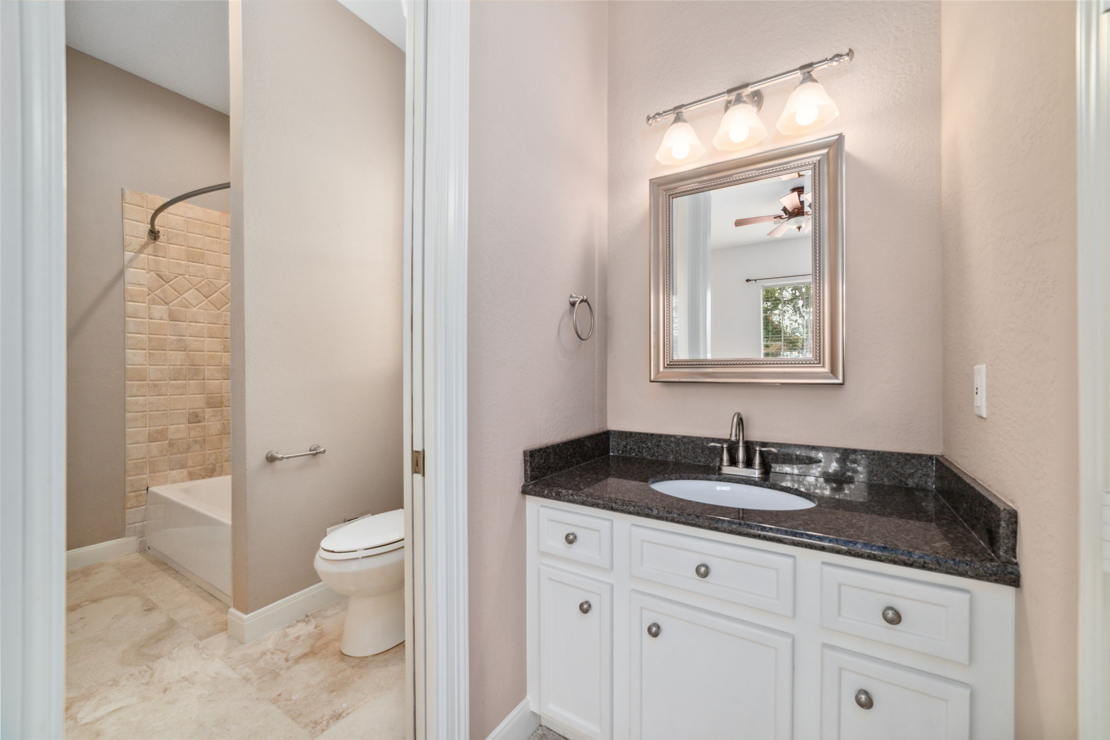 32610 Whitburn Trail Fulshear, TX 77441 - Photo 30 of 49 a bathroom with a granite countertop sink toilet and shower
