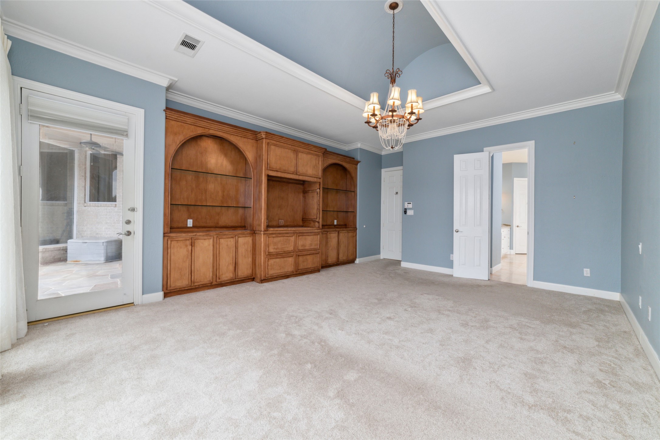 32610 Whitburn Trail Fulshear, TX 77441 - Photo 33 of 49 a view of a livingroom with a chandelier fan and windows