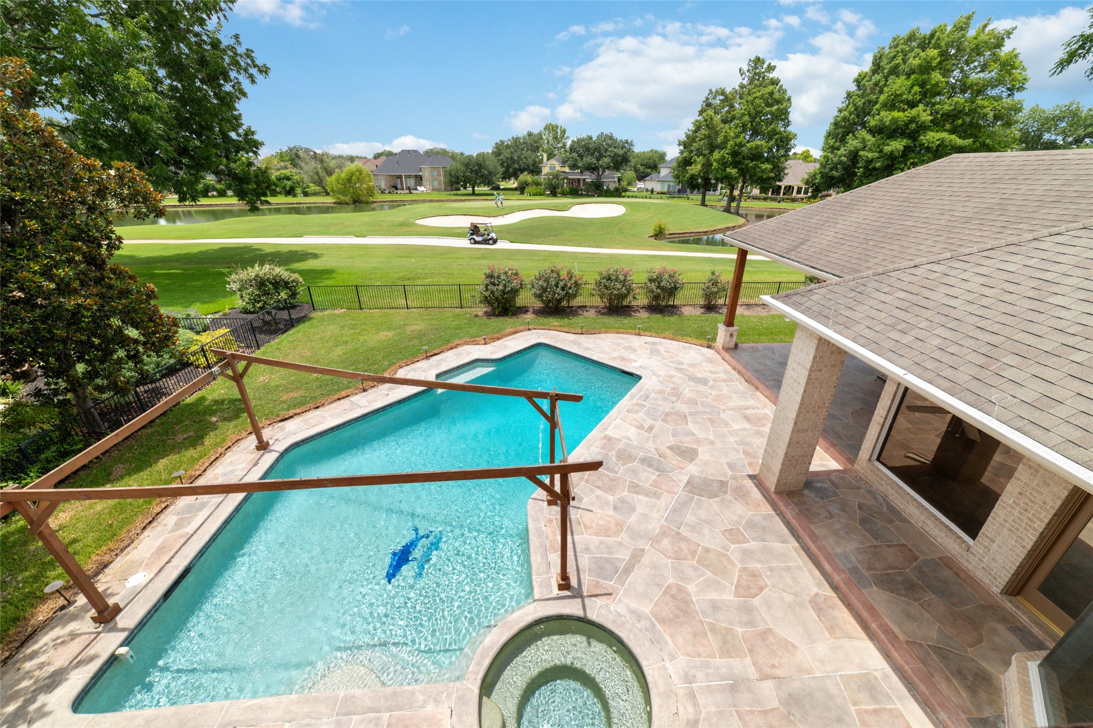 32610 Whitburn Trail Fulshear, TX 77441 - Photo 40 of 49 a view of a swimming pool with a yard and plants