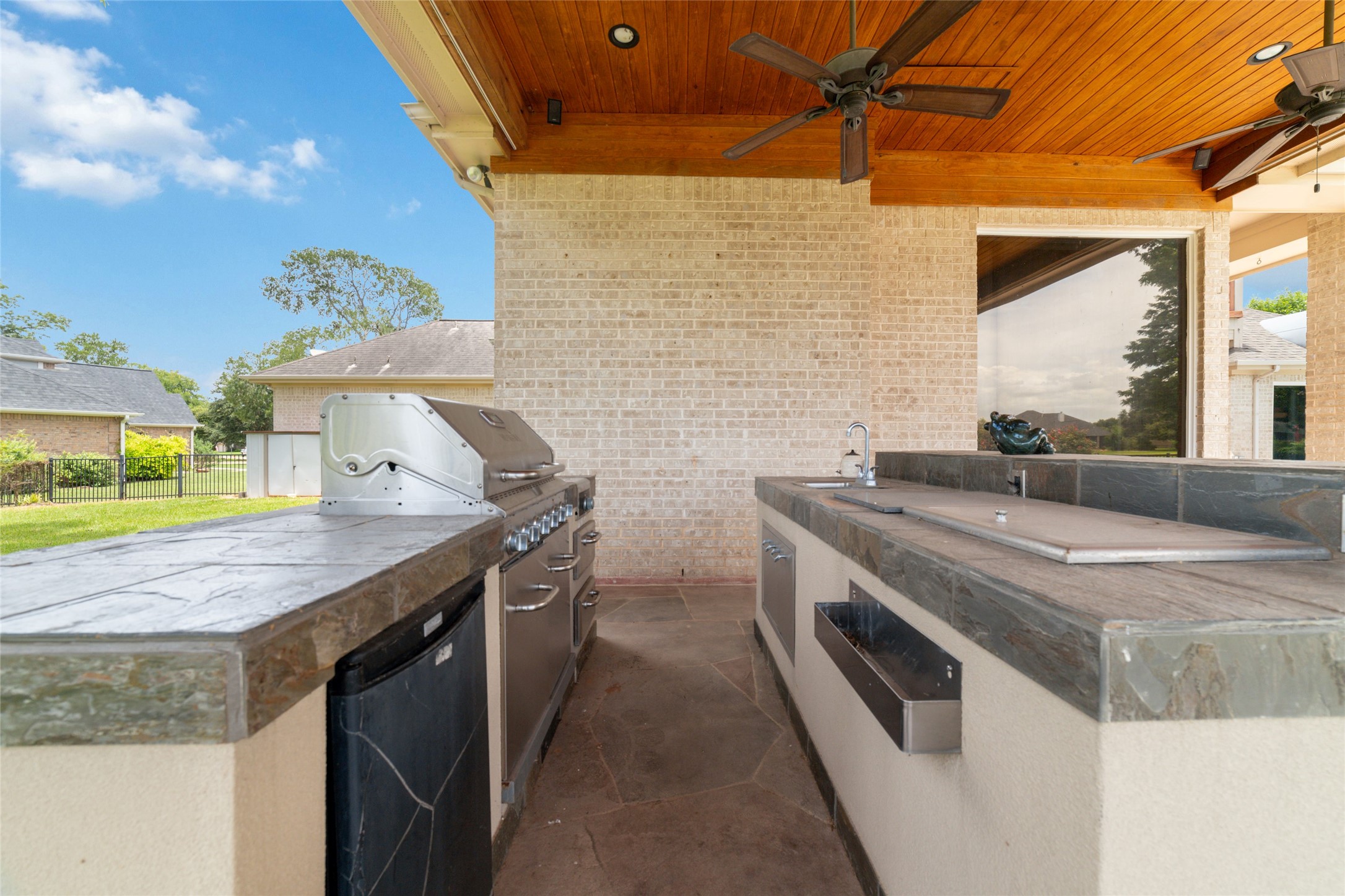32610 Whitburn Trail Fulshear, TX 77441 - Photo 44 of 49 a kitchen with stainless steel appliances granite countertop a sink and a stove