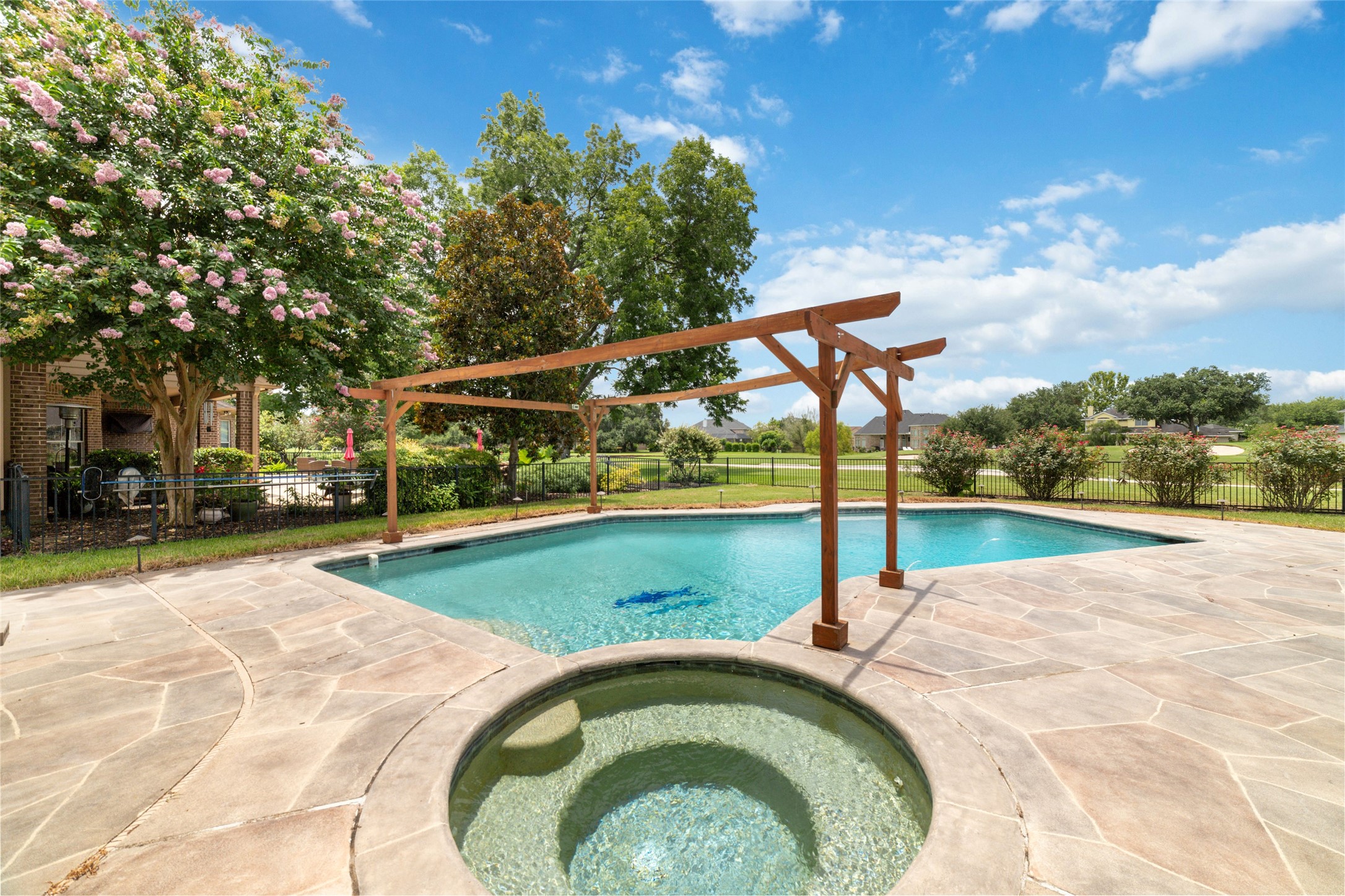 32610 Whitburn Trail Fulshear, TX 77441 - Photo 46 of 49 a view of a swimming pool with a patio