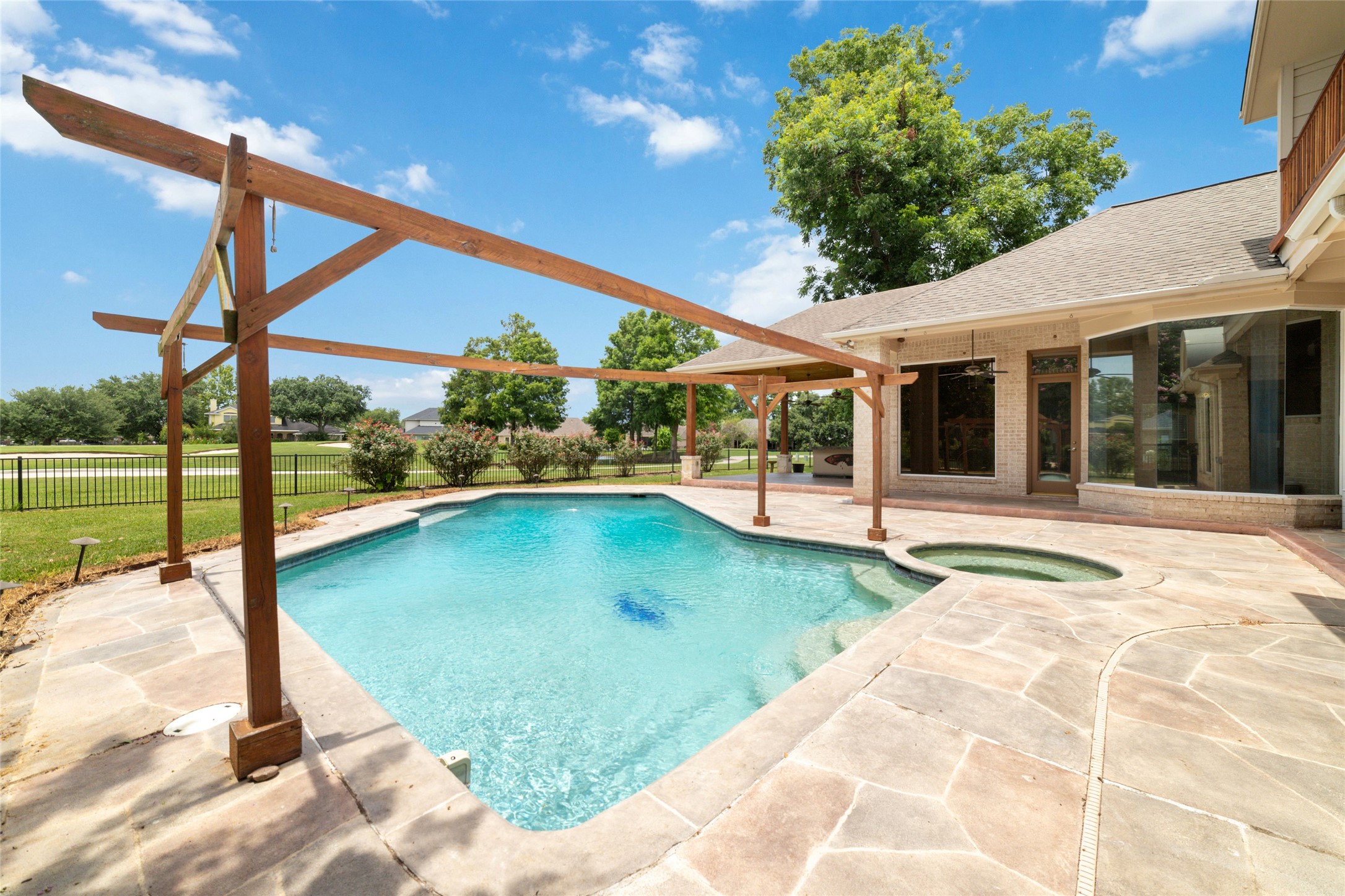 32610 Whitburn Trail Fulshear, TX 77441 - Photo 47 of 49 a view of a house with a swimming pool