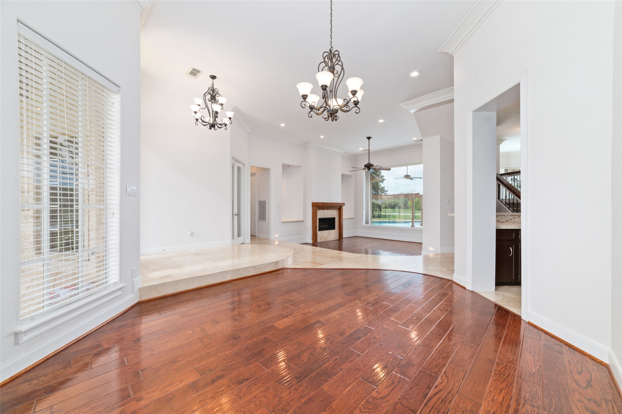 32610 Whitburn Trail Fulshear, TX 77441 - Photo 9 of 49 a view of an empty room with a window and wooden floor
