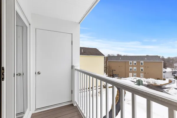 a view of balcony with furniture