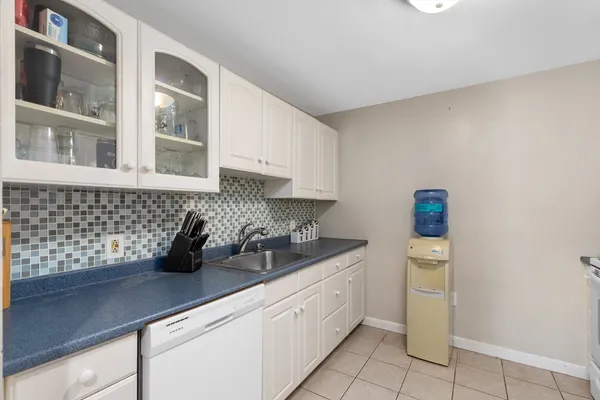 a kitchen with a sink and cabinets