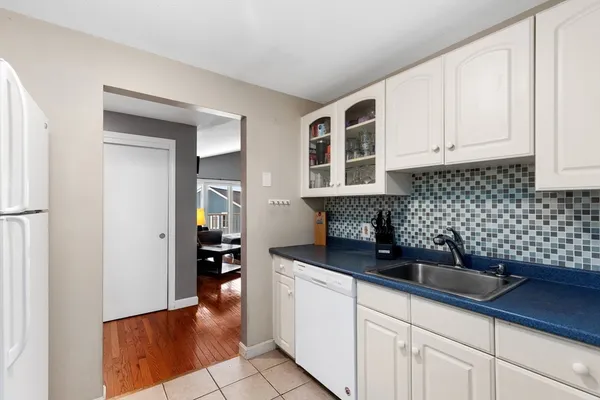 a kitchen with a sink and cabinets