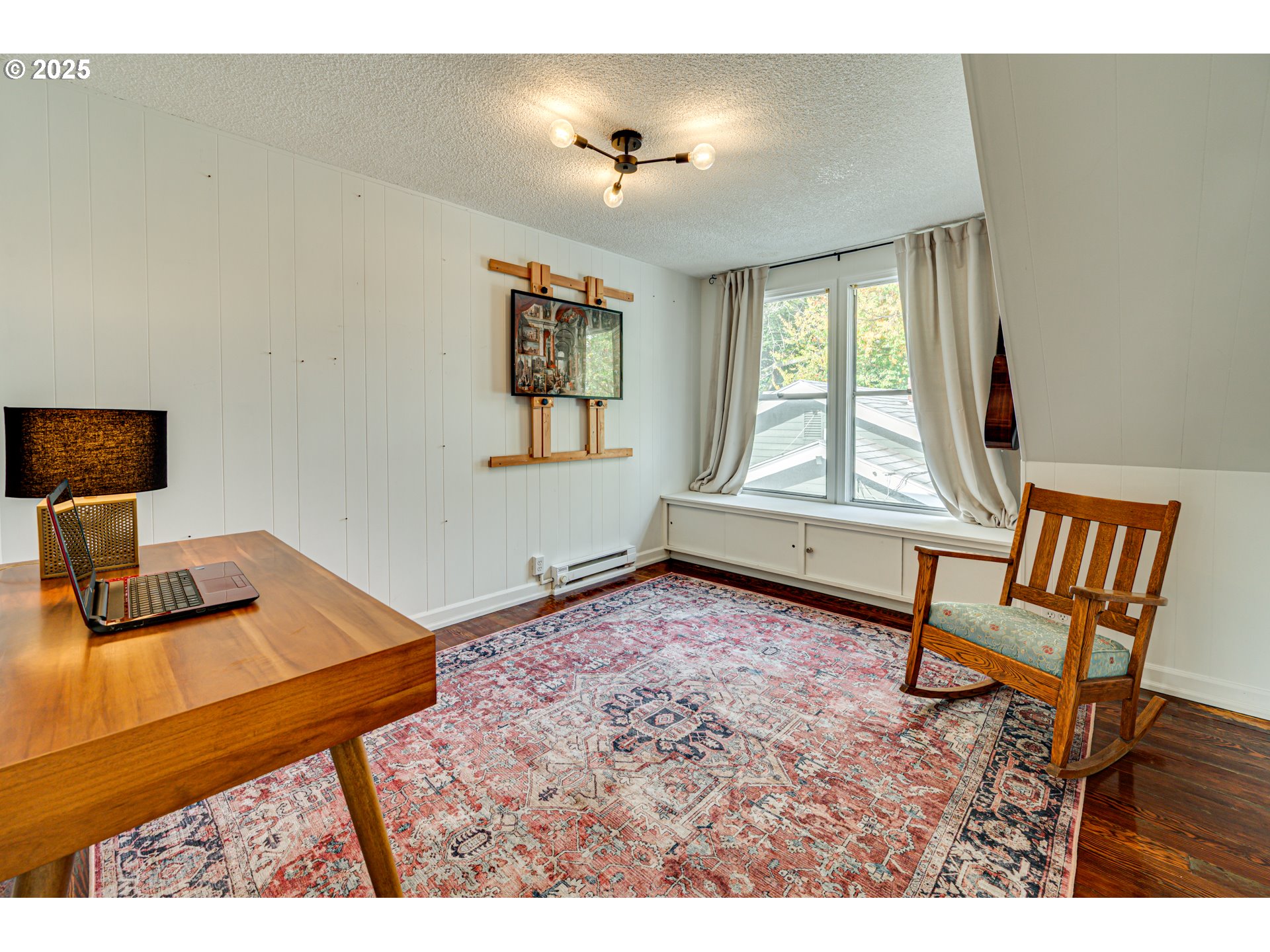 1626 21st Avenue Longview, WA 98632 - Photo 25 of 42 a living room with a bed furniture and a window