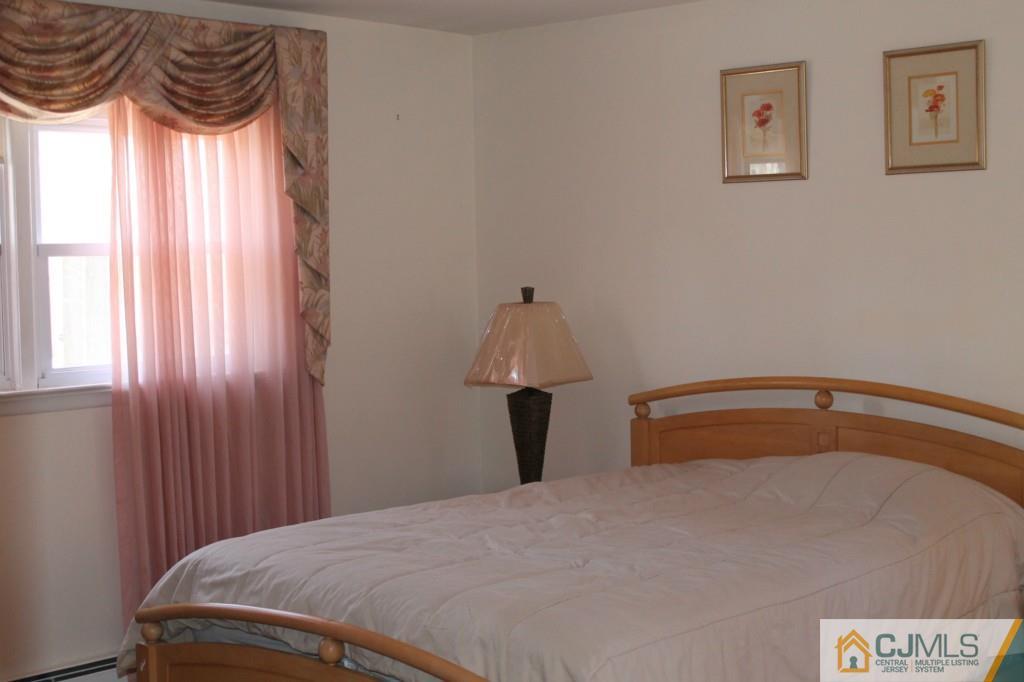 10 Greenwich Road Edison, NJ 08820 - Photo 14 of 25 a bedroom with a bed and a window