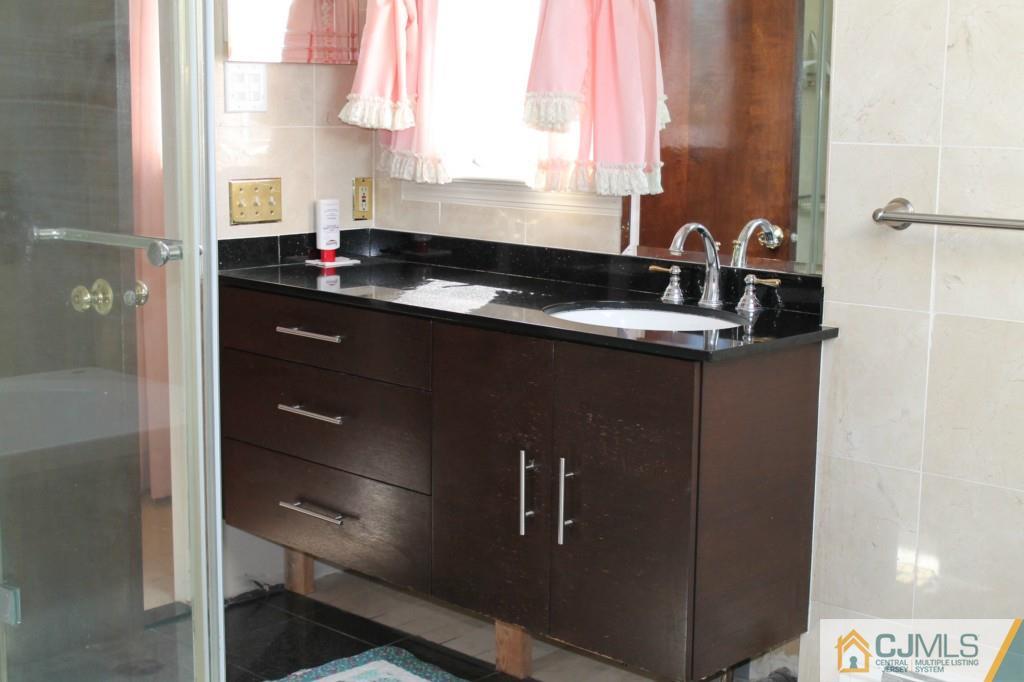 10 Greenwich Road Edison, NJ 08820 - Photo 17 of 25 a kitchen with a sink and a window