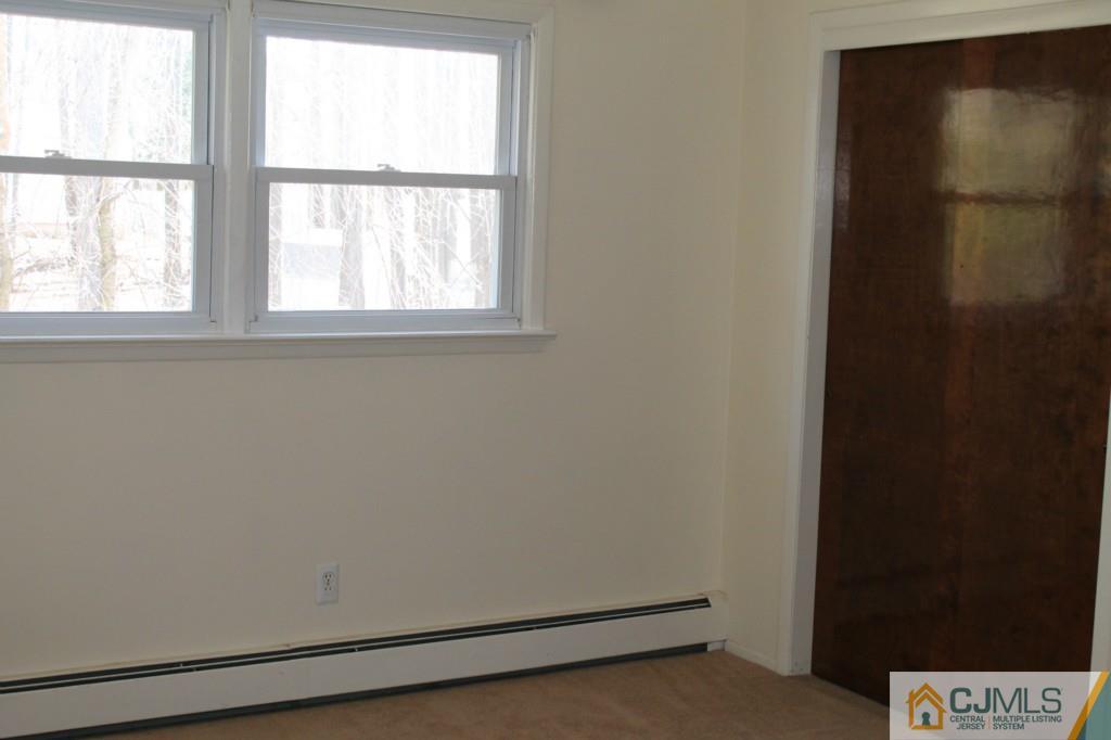 10 Greenwich Road Edison, NJ 08820 - Photo 18 of 25 an empty room with a window