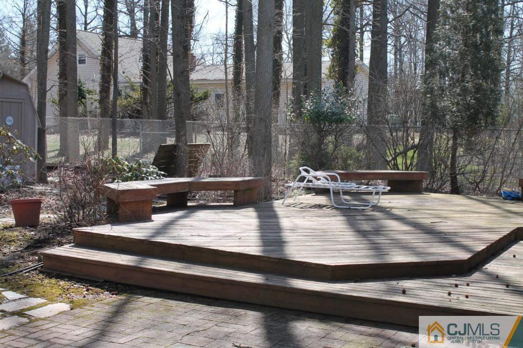 10 Greenwich Road Edison, NJ 08820 - Photo 22 of 25 a view of a lake with couches chairs and wooden floor