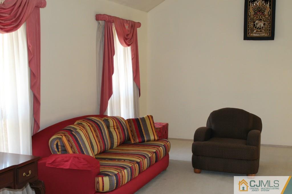 10 Greenwich Road Edison, NJ 08820 - Photo 5 of 25 a living room with furniture and a couch