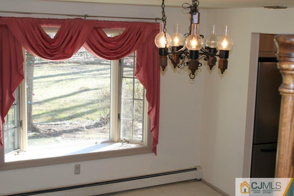 10 Greenwich Road Edison, NJ 08820 - Photo 6 of 25 a bathroom with a mirror and a window