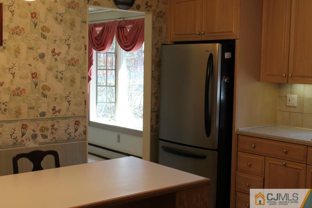10 Greenwich Road Edison, NJ 08820 - Photo 8 of 25 a kitchen with a refrigerator and a sink
