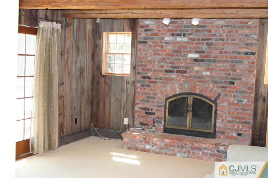 10 Greenwich Road Edison, NJ 08820 - Photo 10 of 25 a living room with a fireplace