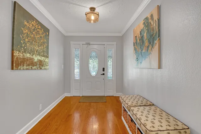 a kitchen with stainless steel appliances granite countertop a refrigerator a stove and cabinets