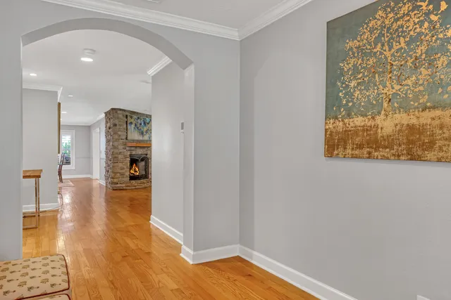 a kitchen with stainless steel appliances granite countertop a refrigerator a sink a stove and oven