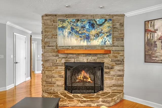 a spacious bedroom with a bed and dresser