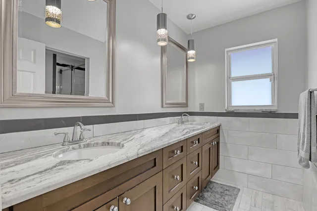 a view of a house with a swimming pool and porch with furniture