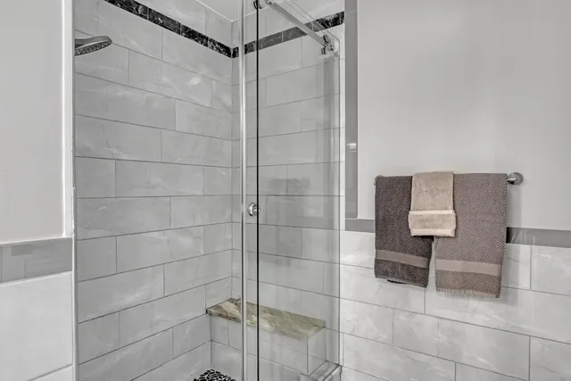 a view of a swimming pool with a lounge chair