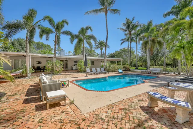 an aerial view of a house with a lake view