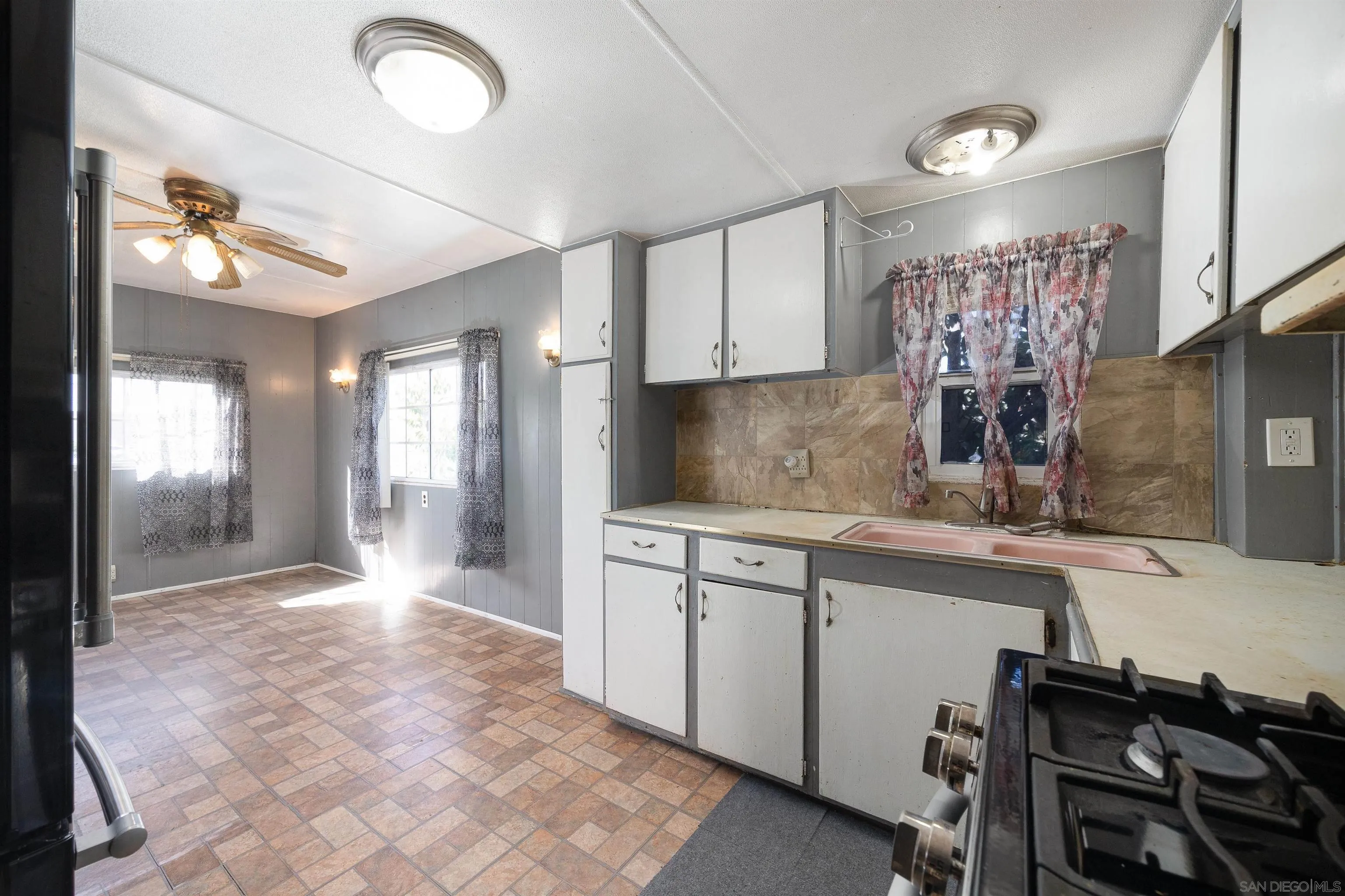 1023 Outer Road, Unit 24 San Diego, CA 92154 - Photo 3 of 16 a large kitchen with cabinets
