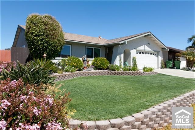 Front yard with beautiful brickwork and landscaping