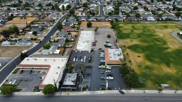 an aerial view of residential houses with outdoor space