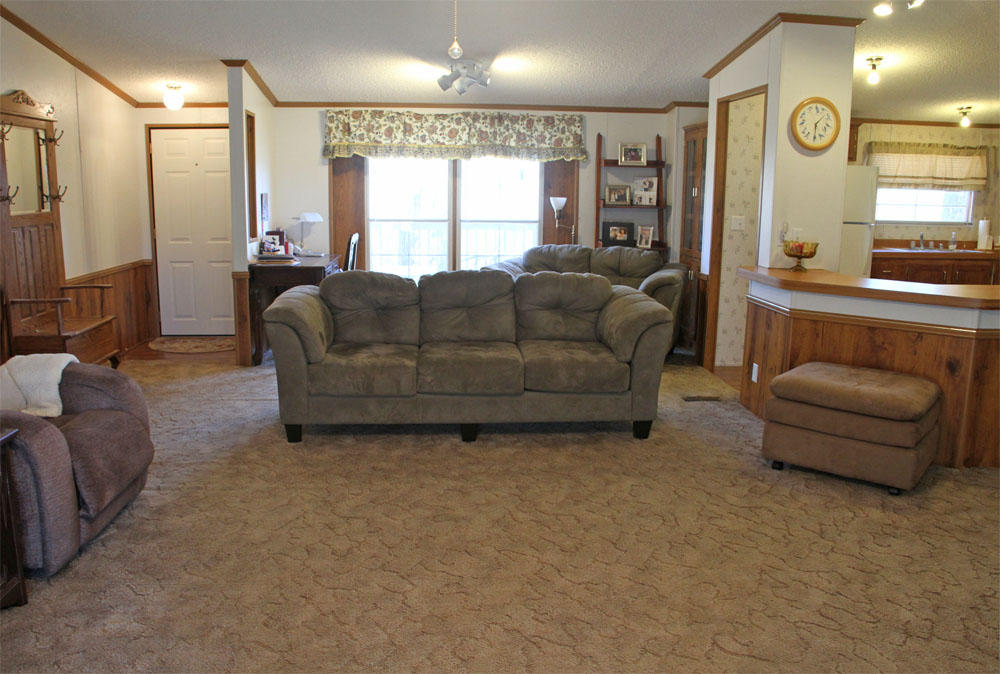 1084 Treasure Lane Blue Ridge, VA 24064 - Photo 15 of 37 a living room with furniture and a large window