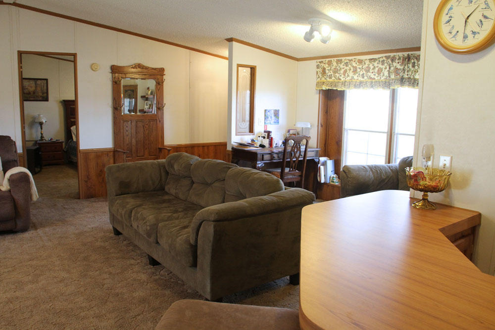 1084 Treasure Lane Blue Ridge, VA 24064 - Photo 17 of 37 a living room with furniture and a large window