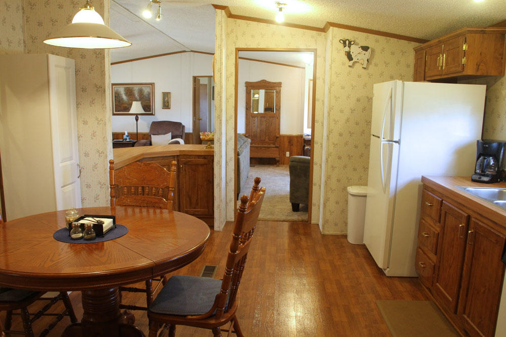 1084 Treasure Lane Blue Ridge, VA 24064 - Photo 20 of 37 a view of a dining room with furniture and wooden floor