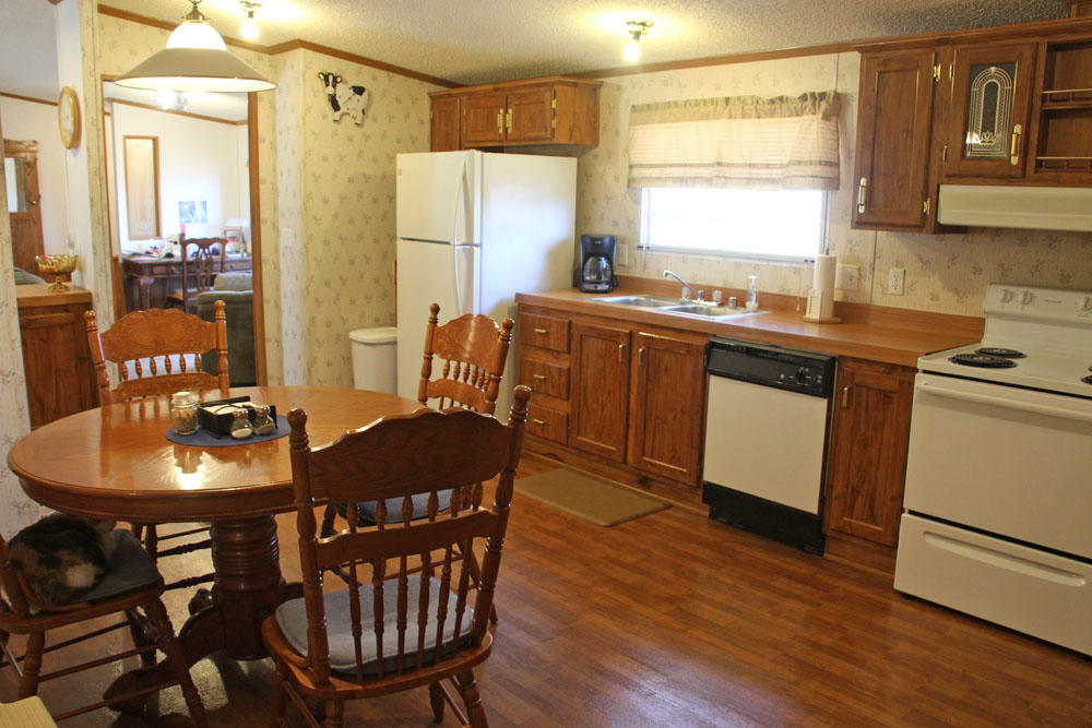 1084 Treasure Lane Blue Ridge, VA 24064 - Photo 21 of 37 a view of a dining room with furniture window and wooden floor