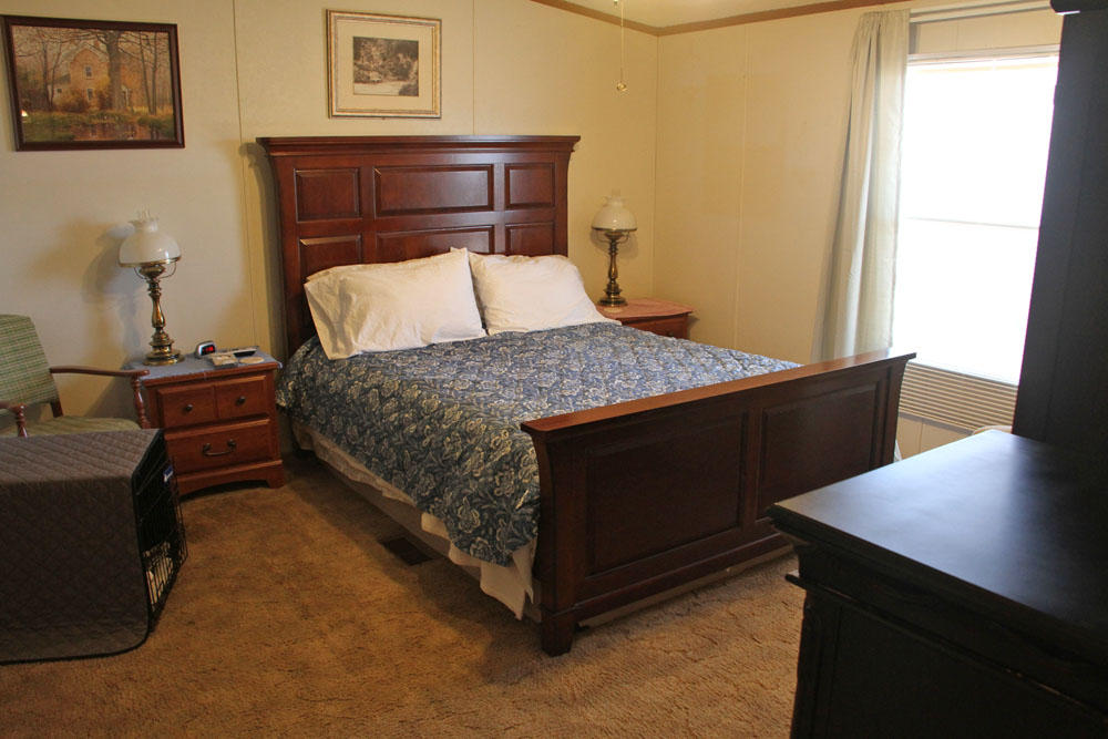 1084 Treasure Lane Blue Ridge, VA 24064 - Photo 26 of 37 a bedroom with a bed and a desk