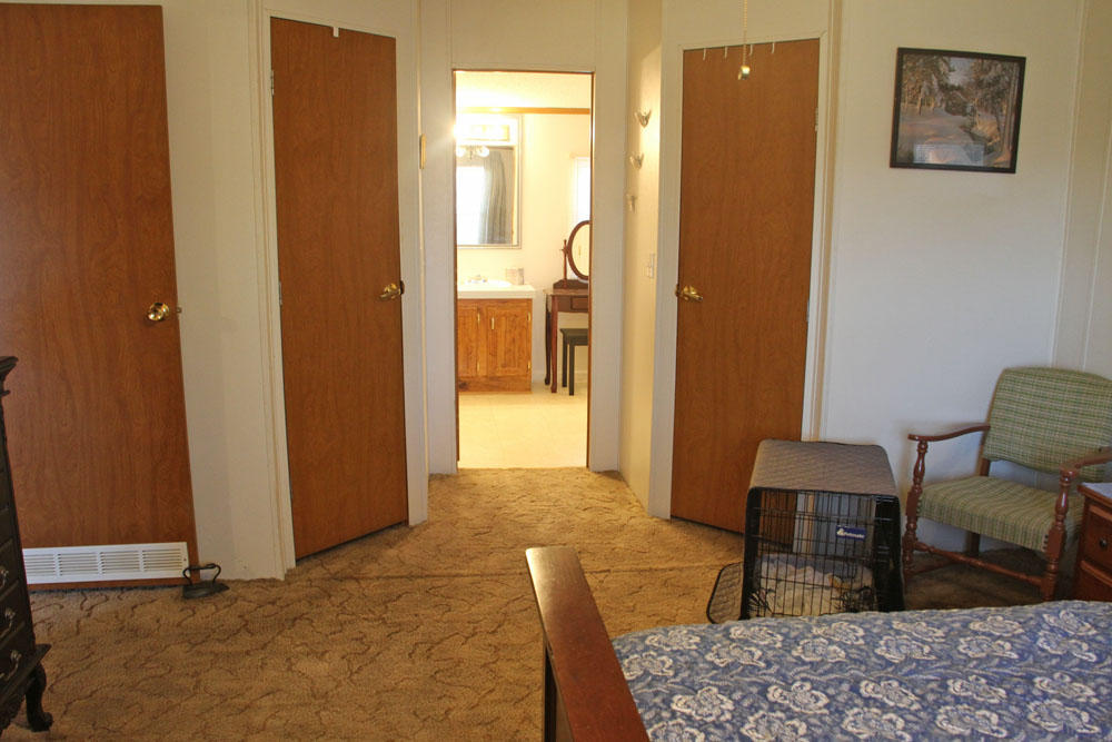 1084 Treasure Lane Blue Ridge, VA 24064 - Photo 27 of 37 a bedroom with furniture and a rug
