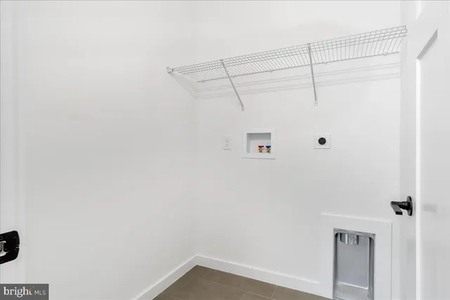 a view of a hallway with wooden floor and entryway