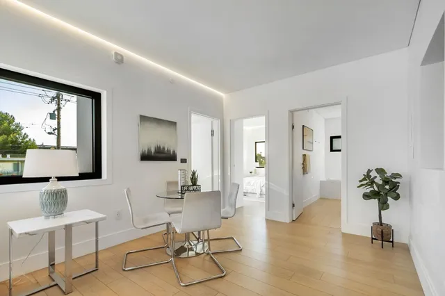 a bedroom with a bed and cabinets
